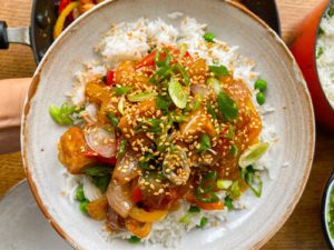 Sweet and Sour Tofu and Rice garnish with sesame seed and spring onion